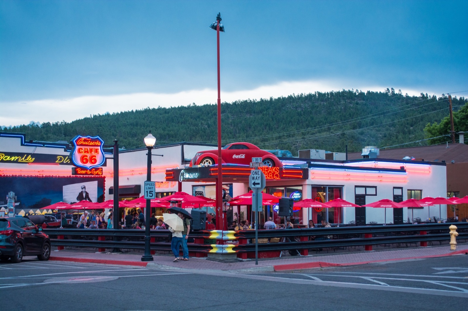 Route 66 neon glowing at dusk in Williams